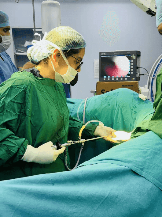 Close-up of laparoscopic surgical tools being used in a delicate procedure
